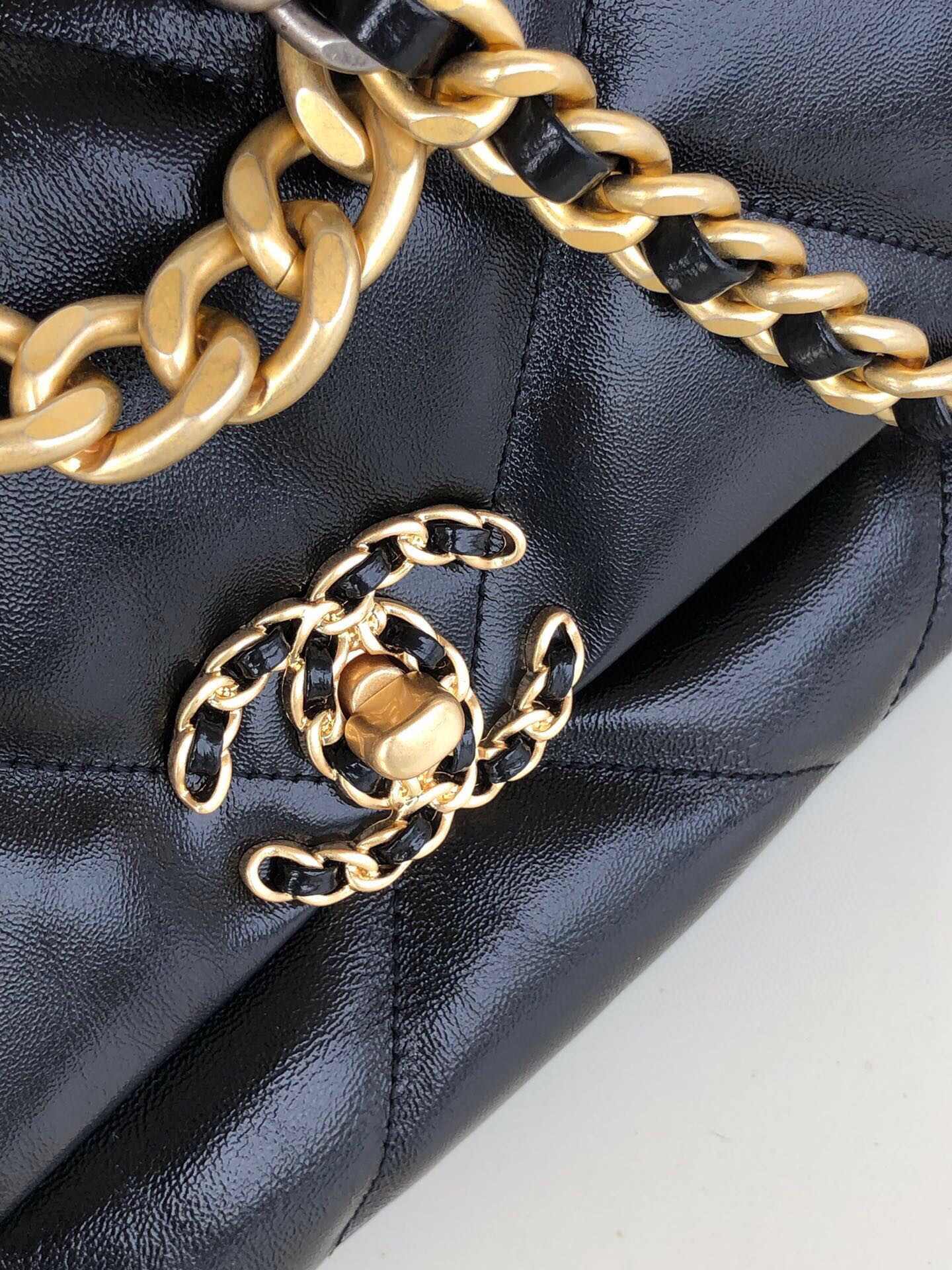 Ch*el 19 handbag shiny leather, gold-tone, silver-tone & ruthenium-finish metal black 6.2 × 10.1 × 3.5 in