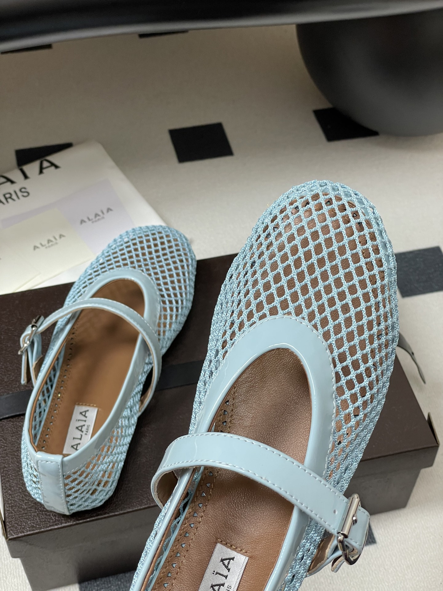 UA ALAÏA BALLET FLATS IN FISHNET